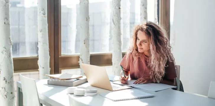 A woman studying on her laptop