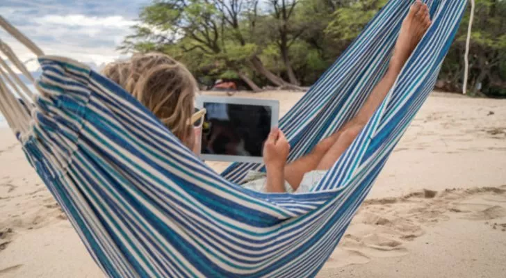 Someone working in a hammock