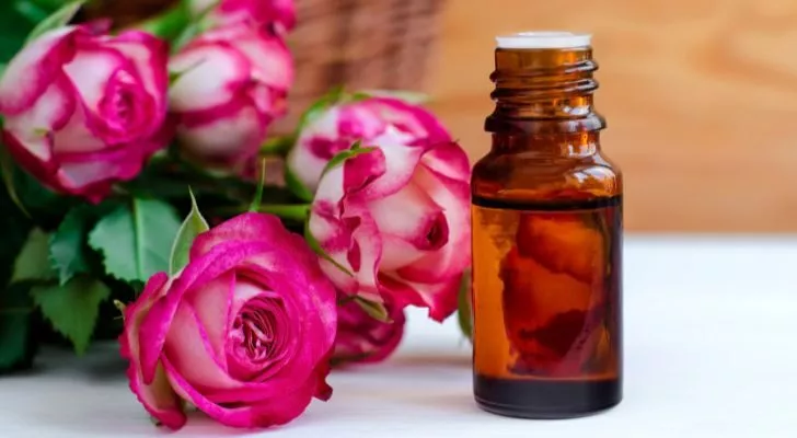 A bottle of perfume made with roses